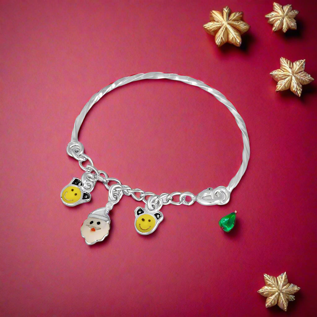 A silver bracelet with charms shaped like smiling faces and small yellow beads, designed for children.