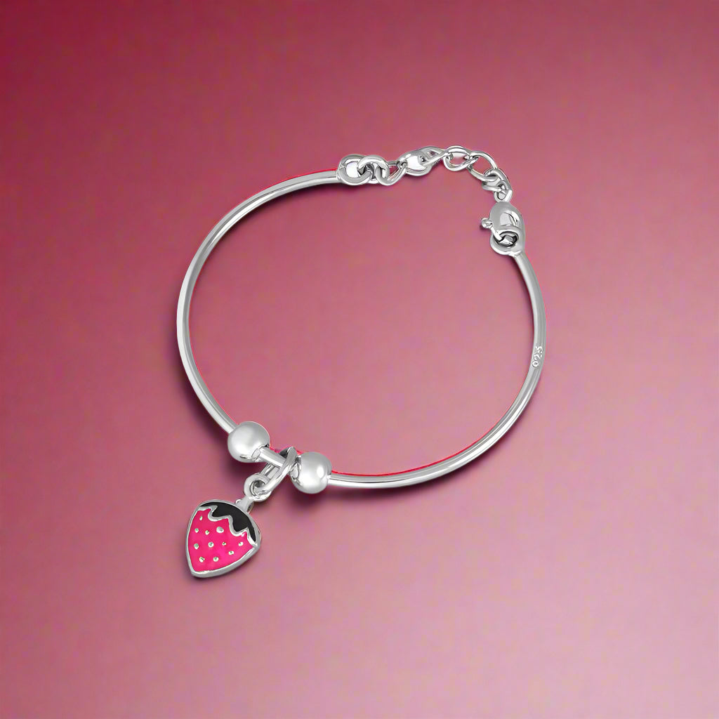 A silver bracelet with a heart-shaped charm, crafted from 925 silver, designed for children.