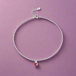 Load image into Gallery viewer, Silver anklet with a red heart charm on a white background
