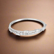 A sterling silver bracelet adorned with cubic zirconia stones.