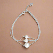 A sterling silver bracelet featuring a chain design with two AAA cubic zirconia accents.