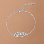 Load image into Gallery viewer, Silver bracelet with a decorative clasp on a white background
