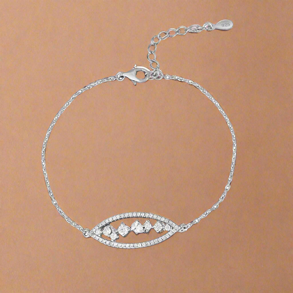 Silver bracelet with a decorative clasp on a white background