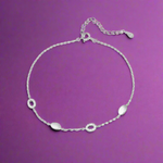 Load image into Gallery viewer, Silver anklet with small round pendants on a white background
