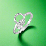 A 925 sterling silver ring with cubic zirconia stones, featuring a heart-shaped design.