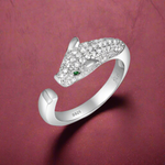 Load image into Gallery viewer, A sterling silver ring with a panther motif and cubic zirconia stones set around the band.
