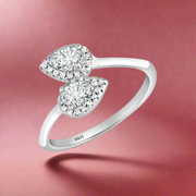 A sterling silver adjustable ring with a kaleidoscope pear design, encrusted with cubic zirconia, displayed on a white background.