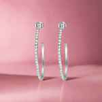 Load image into Gallery viewer, A pair of 925 sterling silver hoop earrings with intricate detailing, presented against a white background.

