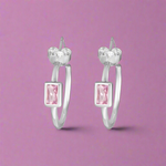Load image into Gallery viewer, A pair of silver hoop earrings with a pink and clear color scheme.

