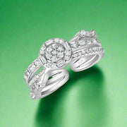 A round 925 sterling silver ring with a central cubic zircon embellishment and clear AAA cubic zircons set in a polished band.