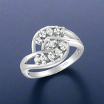 Load image into Gallery viewer, A sterling silver ring with a solitaire design, featuring a central cubic zirconia surrounded by smaller clear cubic zirconia, with a total weight of 925 grams.

