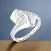 A white gold sterling silver ring with a clear, sparkling centerpiece surrounded by smaller clear cubic zirconia stones set in a classic six-prong setting.