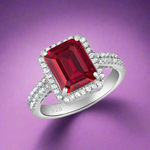 Load image into Gallery viewer, A 925 sterling silver ring with a large red cubic zirconia centerpiece, surrounded by smaller clear cubic zirconia stones on the band.
