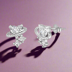 Load image into Gallery viewer, A pair of 925 sterling silver earrings featuring a heart design with cubic zirconia stones.
