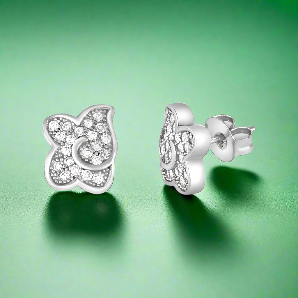 A pair of sterling silver earrings in a butterfly wing design, adorned with cubic zirconia.