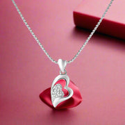 A 925 silver pendant in the shape of a heart with a chain, adorned with cubic zirconia stones.